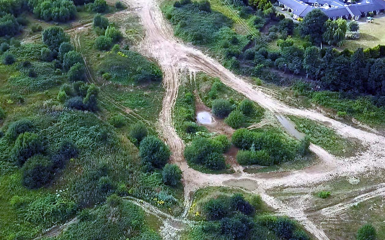 Drone aerial view off roading Dirt Track site in St Albans Bricket Wood